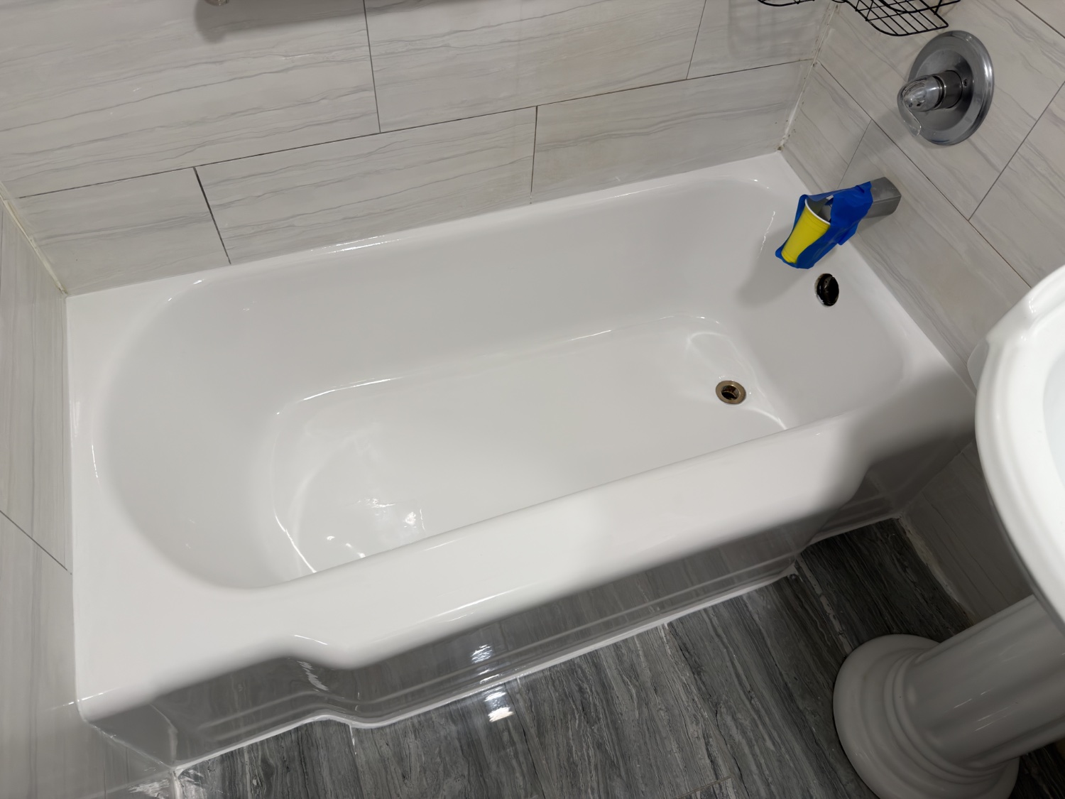 A 1928 cast-iron tub refinishing A 1928 cast-iron tub refinishing